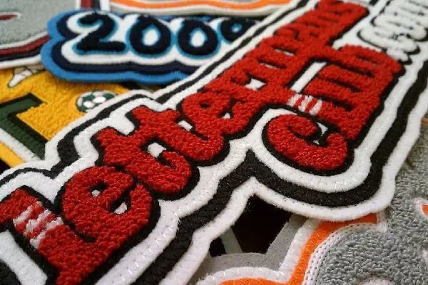 chenille embroidery patches in red and green color done by cheez clothing factory