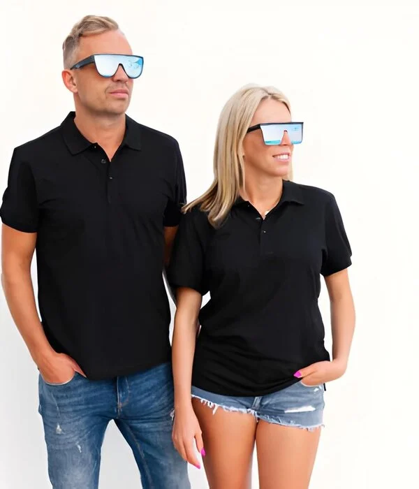 couple wearing custom black polo shirts white background