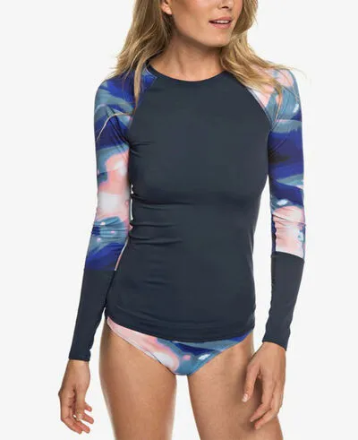 female wearing multiple color rash guard